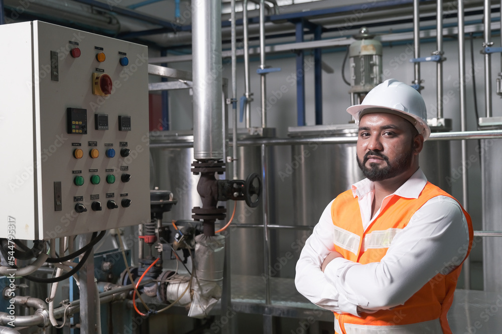 South Asia male factory worker or Man engineer or expert staff is maintenance and checking control system South Asia male factory worker or Man engineer or expert staff is maintenance and checking control system