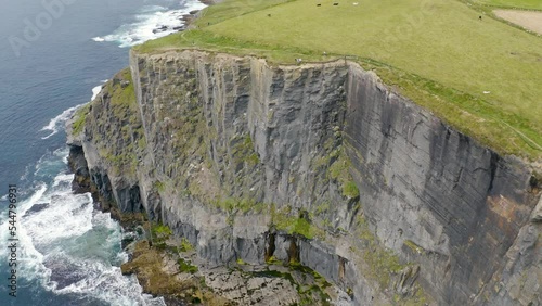 Cliffs of Moher, Ireland, Wild Atlantic Way. Atlantic Ocean. Beautiful tourist destination and attraction from above. 4K drone. photo