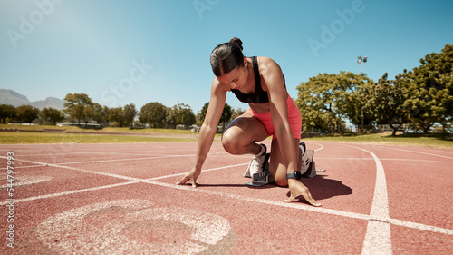 Runner, stadium and fitness with woman start for running race, training and cardio on outdoor track. Competition, exercise and run for sport, marathon and sprint with workout motivation and endurance