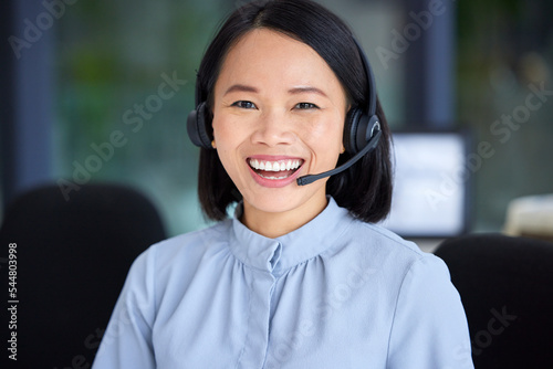 Portrait, call center and customer service with an asian woman consultant working in a sales office. Crm, contact us and support with a happy female employee working in telemarketing or retail