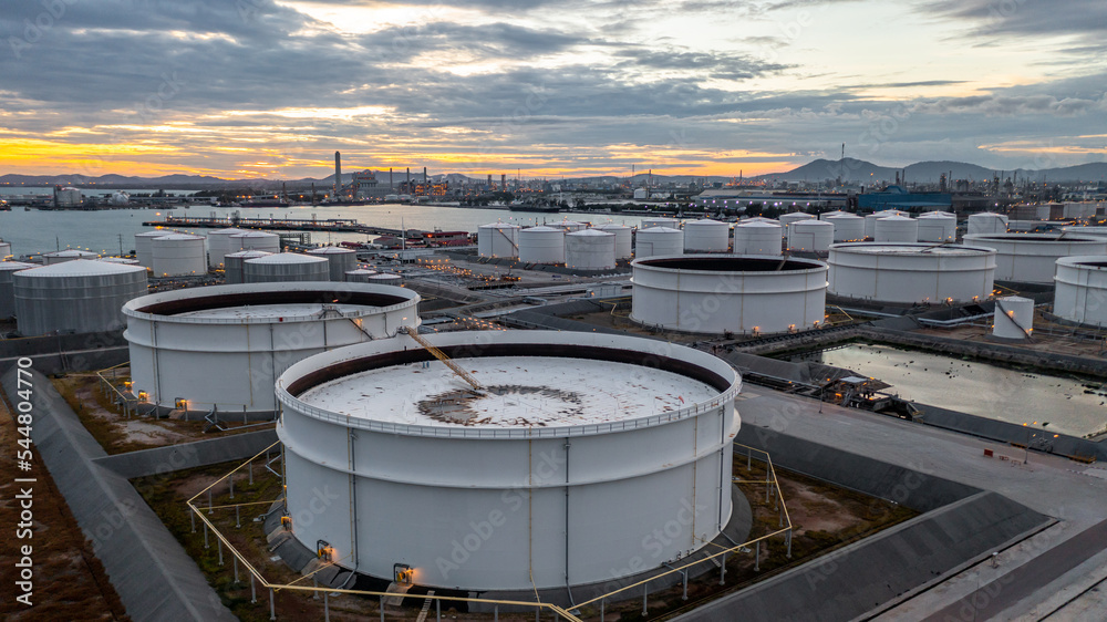 Crude oil storage tank terminal port, Oil terminal pipeline fuel storage tank at oil refinery industrial zone in the cargo seaport and ship tanker and storage silo tank at petrochemical terminal port. Crude oil storage tank terminal port, Oil terminal pipeline fuel storage tank at oil refinery industrial zone in the cargo seaport and ship tanker and storage silo tank at petrochemical terminal port.