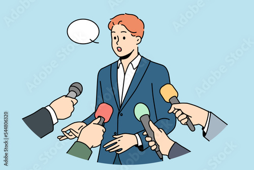 Male politician with speech bubble above head give interview to reporters with microphones. Man in suit speak with journalists with mic. Vector illustration. 