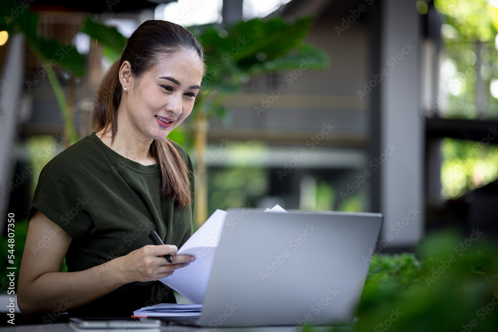 asian woman in casual dress working in outdoor office. Concept for working and open office. asian woman in casual dress working in outdoor office. Concept for working and open office.