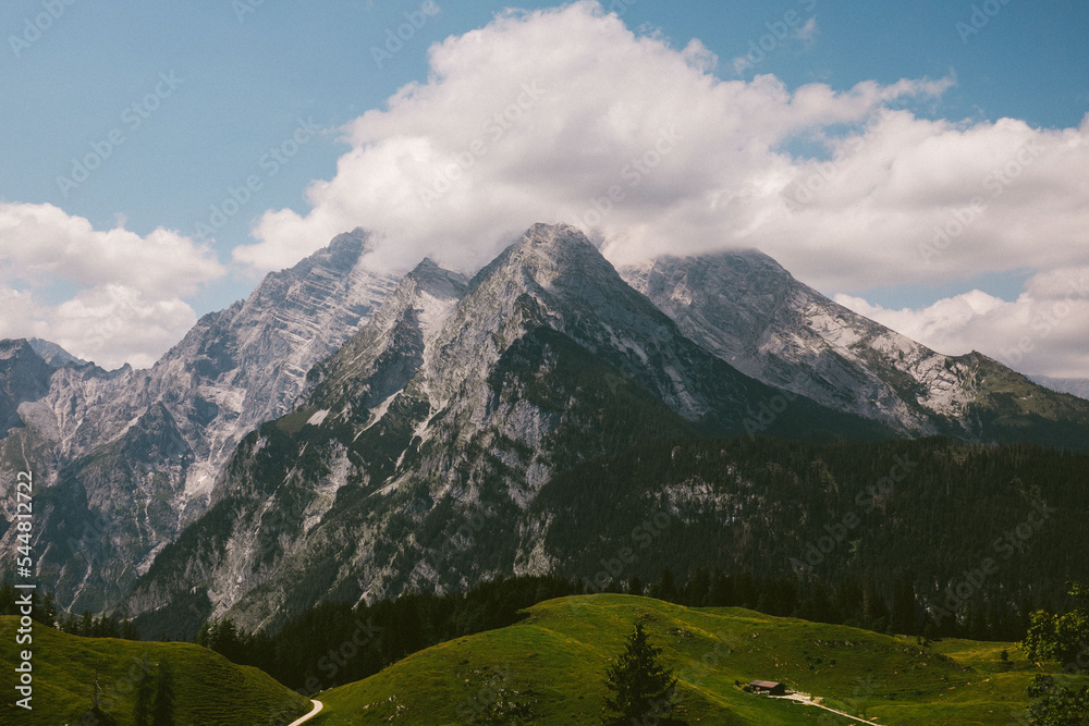 a landscape in the mountains with some clouds