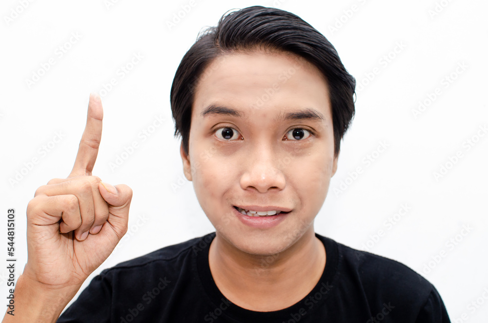 headshot of shocked, surprised, amazed young asian man in black tshirt isolated over white pointing with finger best for bussines advertismnet headshot of shocked, surprised, amazed young asian man in black tshirt isolated over white pointing with finger best for bussines advertismnet