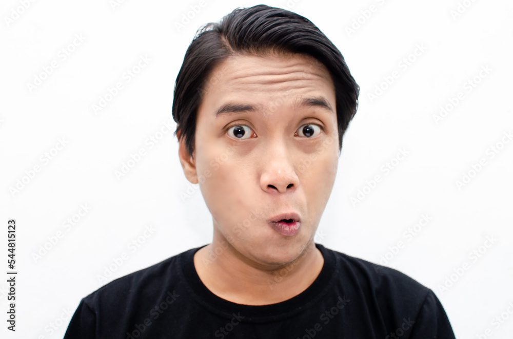 headshot of shocked, surprised, amazed young asian man in black tshirt isolated over white headshot of shocked, surprised, amazed young asian man in black tshirt isolated over white