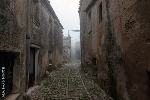Erice city street in morning fog  Sicily  Italy.
