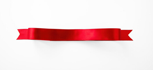 Red satin riibbon banner isolated on white, overhead. Christmas decoration, Valentine day .
