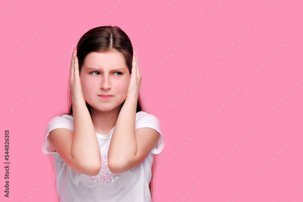 Angry brunette girl closing her ears with hands Angry brunette girl closing her ears with hands