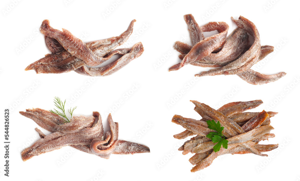 Fototapeta premium Set with delicious anchovy fillets on white background, top view