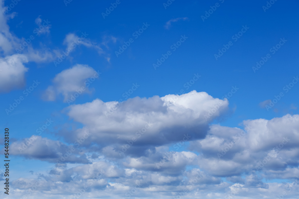 Picturesque blue sky with white clouds on sunny day