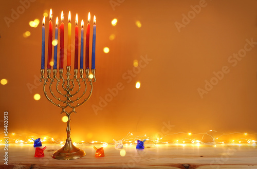 Religion image of jewish holiday Hanukkah background with menorah (traditional candelabra) and candles