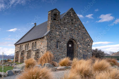 The Church Of Good Shepherd in late winter with beautiful snow capped Southern Alps mountain range in the background. Lake Tekapo, Canterbury, New Zealand South Island.