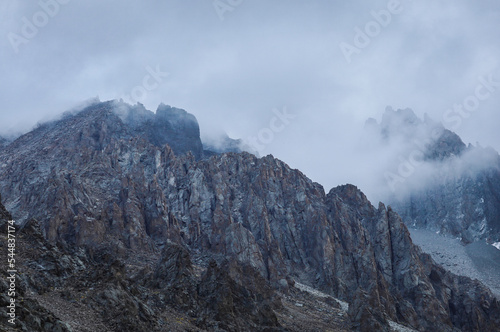 Mountain rocky ridge in the clouds © Александр Довянский