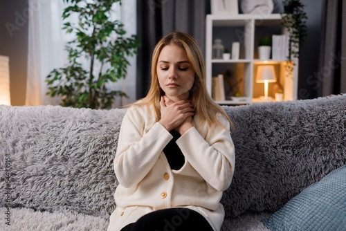 Sick woman with sore throat