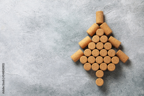 Christmas tree made of wine corks on grey table, top view. Space for text