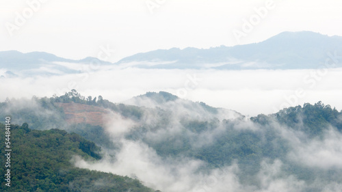 Aerial view of clouds on beautiful mountains that covers the fertile tropical forests South of Thailand. © SU CrossCutting Film