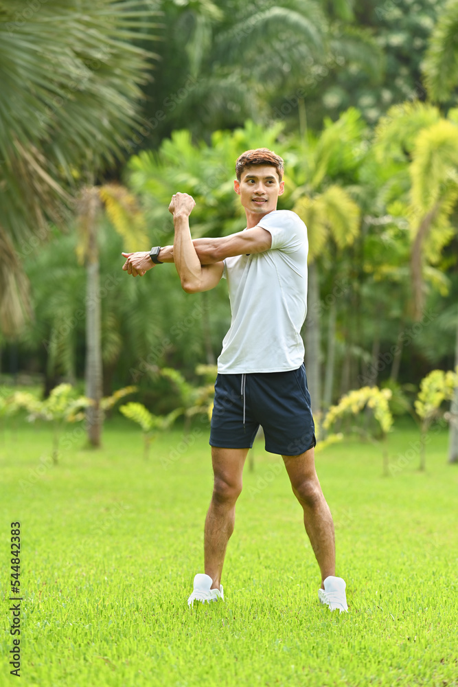 Full length of runner in sport clothing warm up before sports training outdoors. Fitness, sport and healthy lifestyle concept Full length of runner in sport clothing warm up before sports training outdoors. Fitness, sport and healthy lifestyle concept