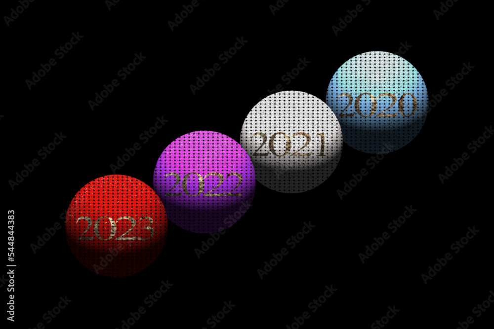 Disposición en esferas de colores del paso de los años sobre fondo negro Disposición en esferas de colores del paso de los años sobre fondo negro
