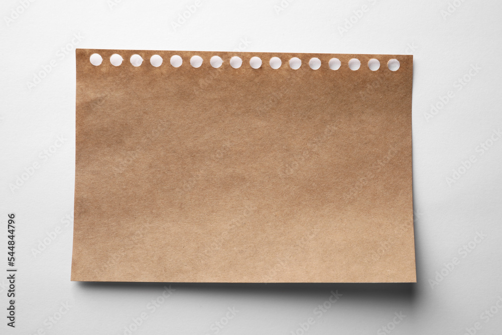 Brown sheet of paper on white background, top view Brown sheet of paper on white background, top view