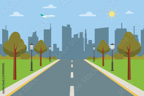 Road to the city with the silhouette of buildings