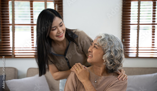 Elderly care and insurance concept, Happy elderly woman with her daughter at home.