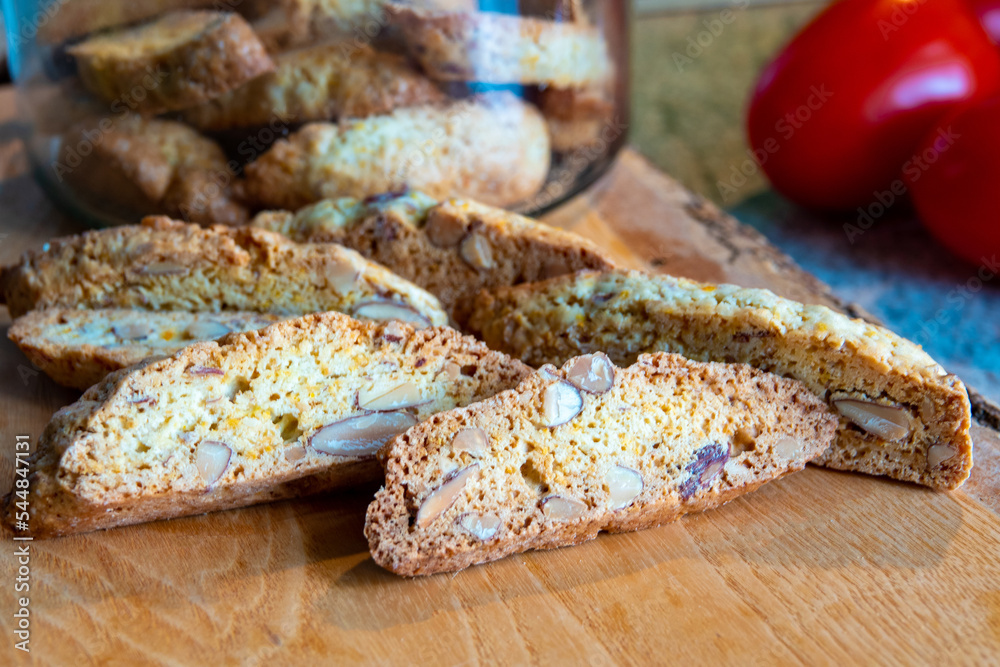 Homemade gluten free biscotti or cantuccini made of buckwheat flour with almonds and chocolate chips on dark rustic wooden background Homemade gluten free biscotti or cantuccini made of buckwheat flour with almonds and chocolate chips on dark rustic wooden background