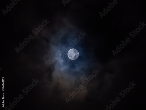 The moon at night with clouds.