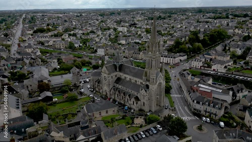 Saint-Martin church with cityscape, Vitré in Brittany, France. Aerial circling photo