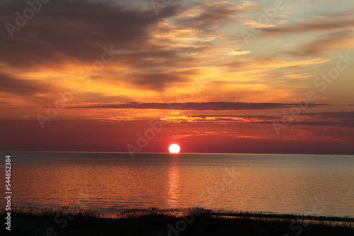 Amazing view on the sun setting setting in the sea. Selective focus