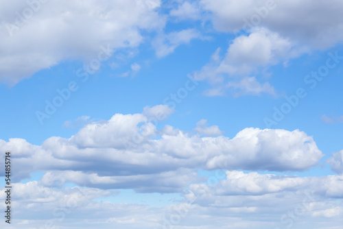 Picturesque view of beautiful fluffy clouds in light blue sky