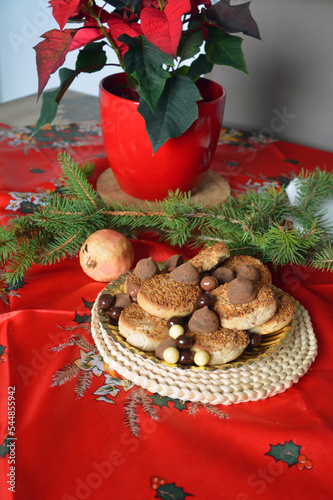 Lovely close up image of Christmas cookies decorated on a plate on a table.