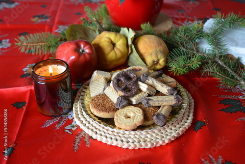 Lovely close up image of Christmas cookies decorated on a plate on a table.