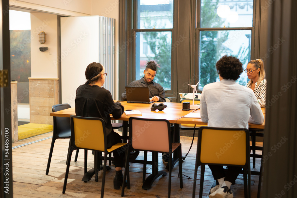 Business people having meeting in board room Business people having meeting in board room