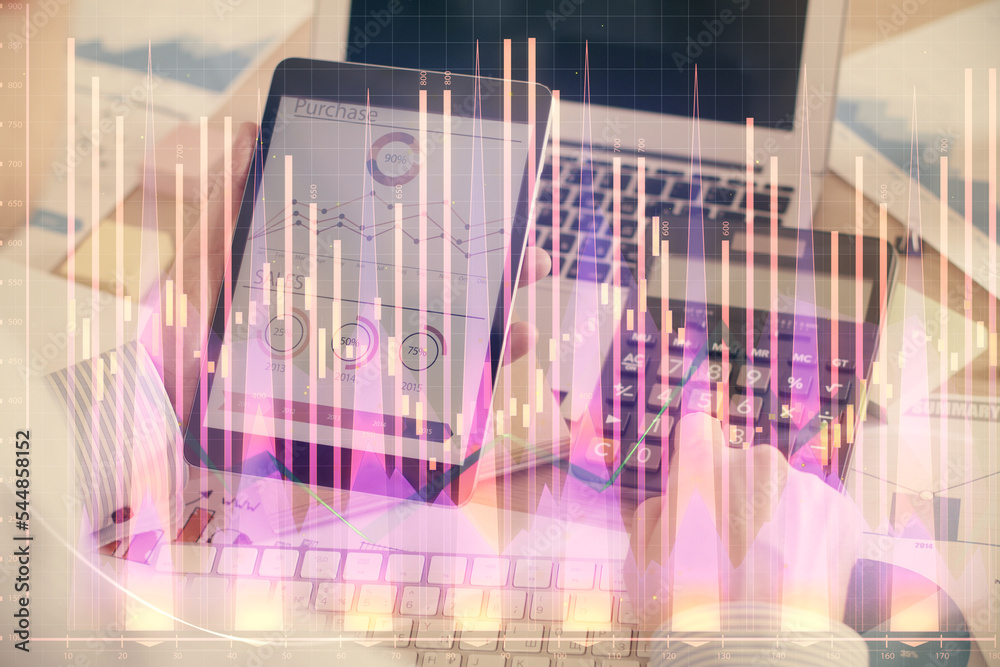 Double exposure of man's hands holding and using a digital device and forex graph drawing. Financial market concept. Double exposure of man's hands holding and using a digital device and forex graph drawing. Financial market concept.