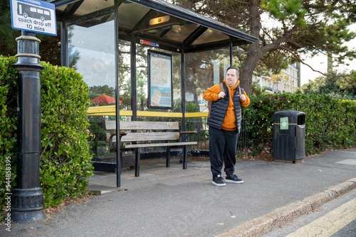 Fotografia Man waiting at bus stop