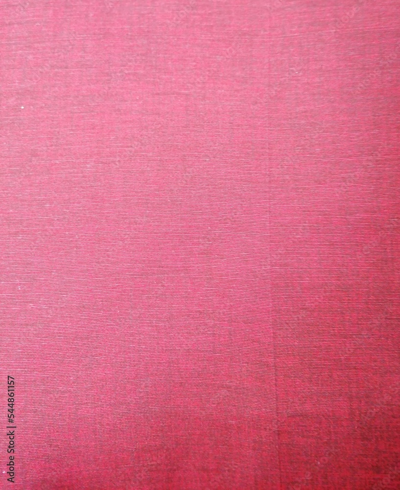 Fototapeta premium Fondo con detalle y textura de superficie textil con tonos rosados y suave degradado de luz