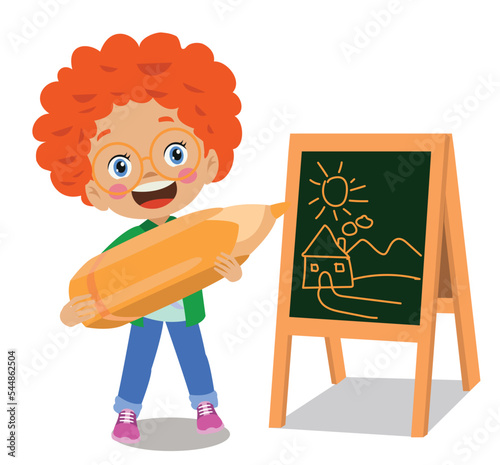 cute boy drawing on blackboard with huge pencil