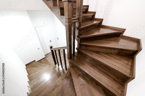 A staircase made of natural oak wood in the house.