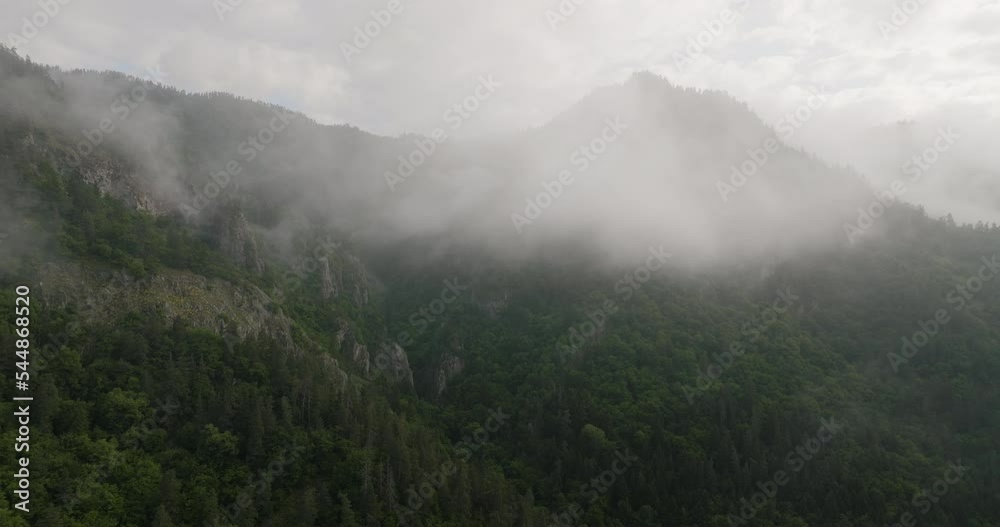 Dramatic Scenery Of Misty Forest Mountains In Borjomi Nature Reserve, Samtskhe-Javakheti, Georgia. Aerial Pullback Dramatic Scenery Of Misty Forest Mountains In Borjomi Nature Reserve, Samtskhe-Javakheti, Georgia. Aerial Pullback