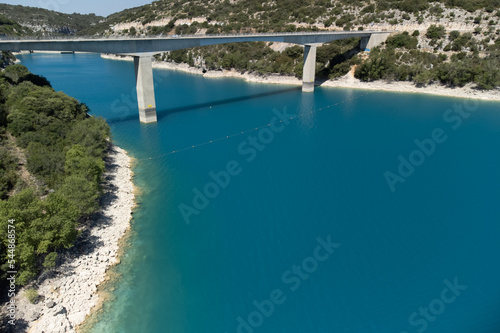 Aerial view on blue lake Sainte-Croix-du-Verdon  road bridge and cliffs  tourists destination in France