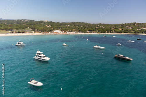 Aerial view of legendary Pampelonne beach near Saint-Tropez, summer vacation on white sandy beaches of French Riviera, France © barmalini