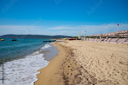 Crystal clear blue water of legendary Pampelonne beach near Saint-Tropez, summer vacation on white sandy beaches of French Riviera, France