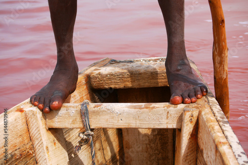 A guide rowing a boat on the Pink  Lake © kaiha