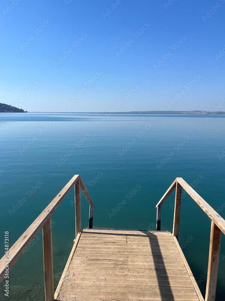 Blue sea horizon, clear blue sky and quiet sea surface