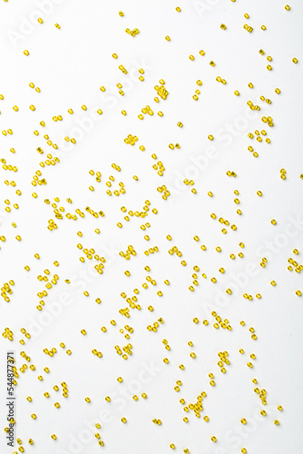 Colorful Yellow Plastic Beads on White Background