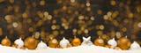 Festive ornaments advent celebration holiday holidays banner greeting card panorama long - Many golden and white baubles, christmas balls on snow, with black concrete wall and bokeh lights background