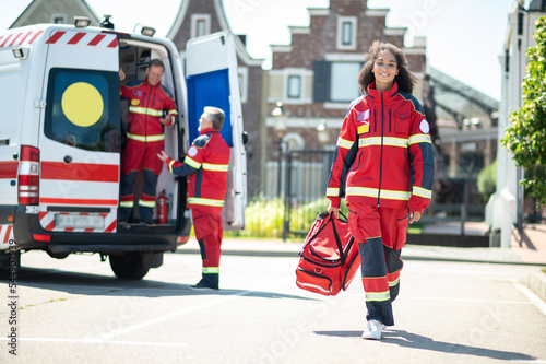 Принти на полотні Cheerful young paramedic arriving for her day shift