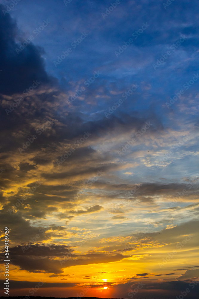 Fototapeta premium sunset sky with multicolor clouds. Dramatic twilight sky background
