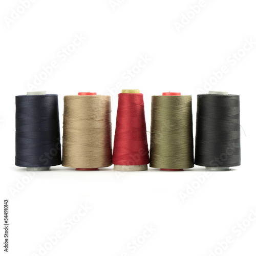 Colored thread in spools on a white background